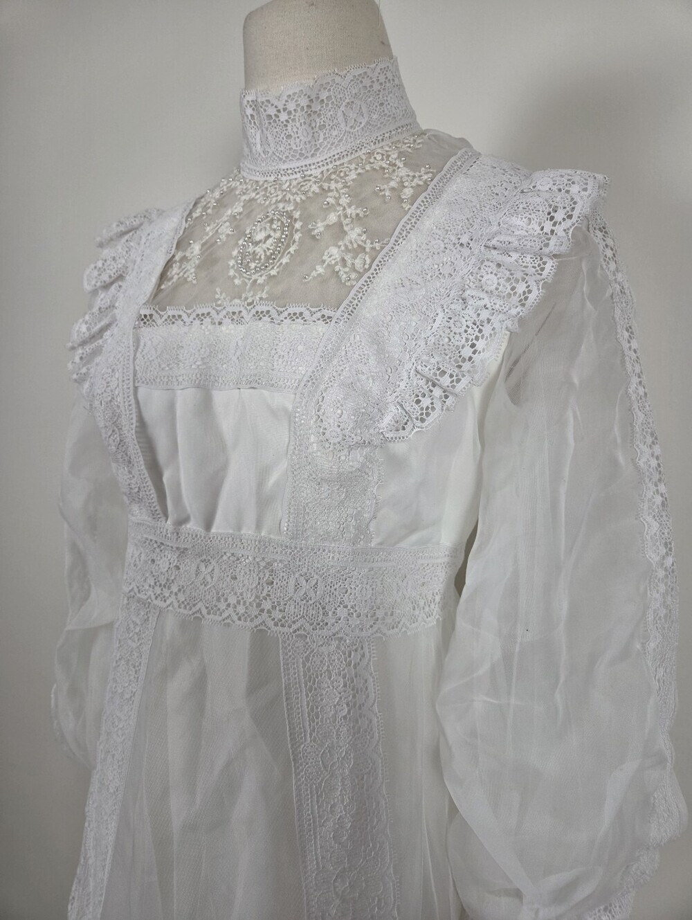 Victorian-Inspired White Lace Bridal Gown with High Neck and Sheer Puff Sleeves - Picture 11 of 13